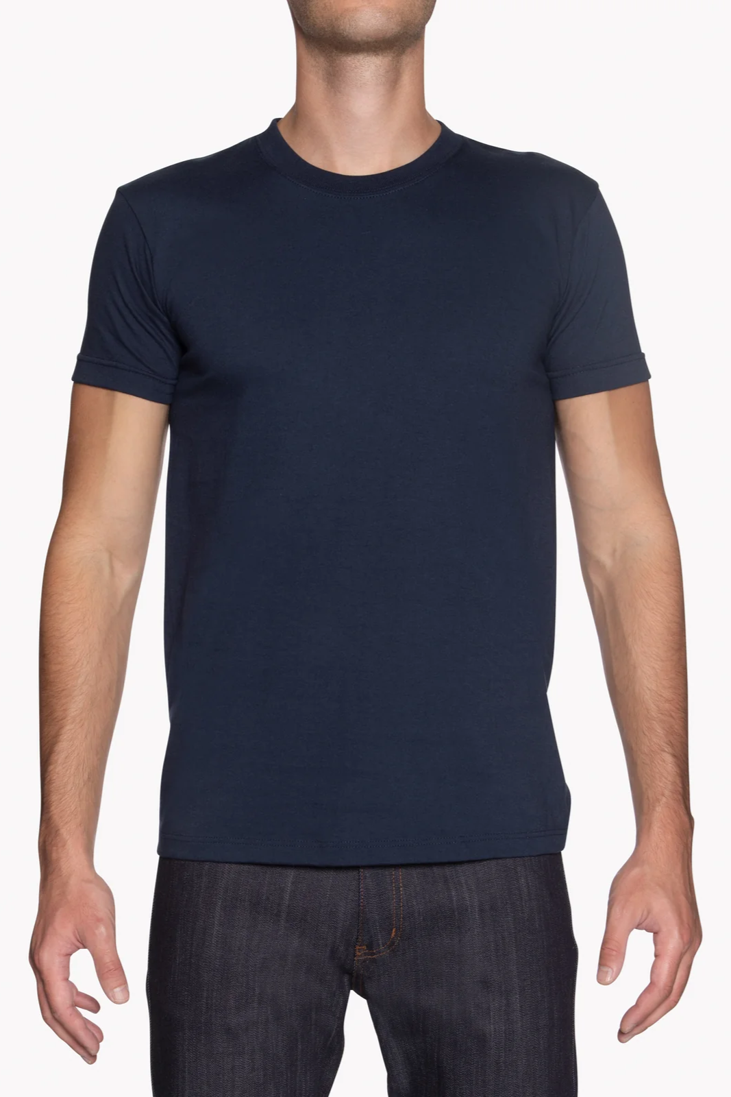 Person wearing a navy blue t-shirt on a white background
