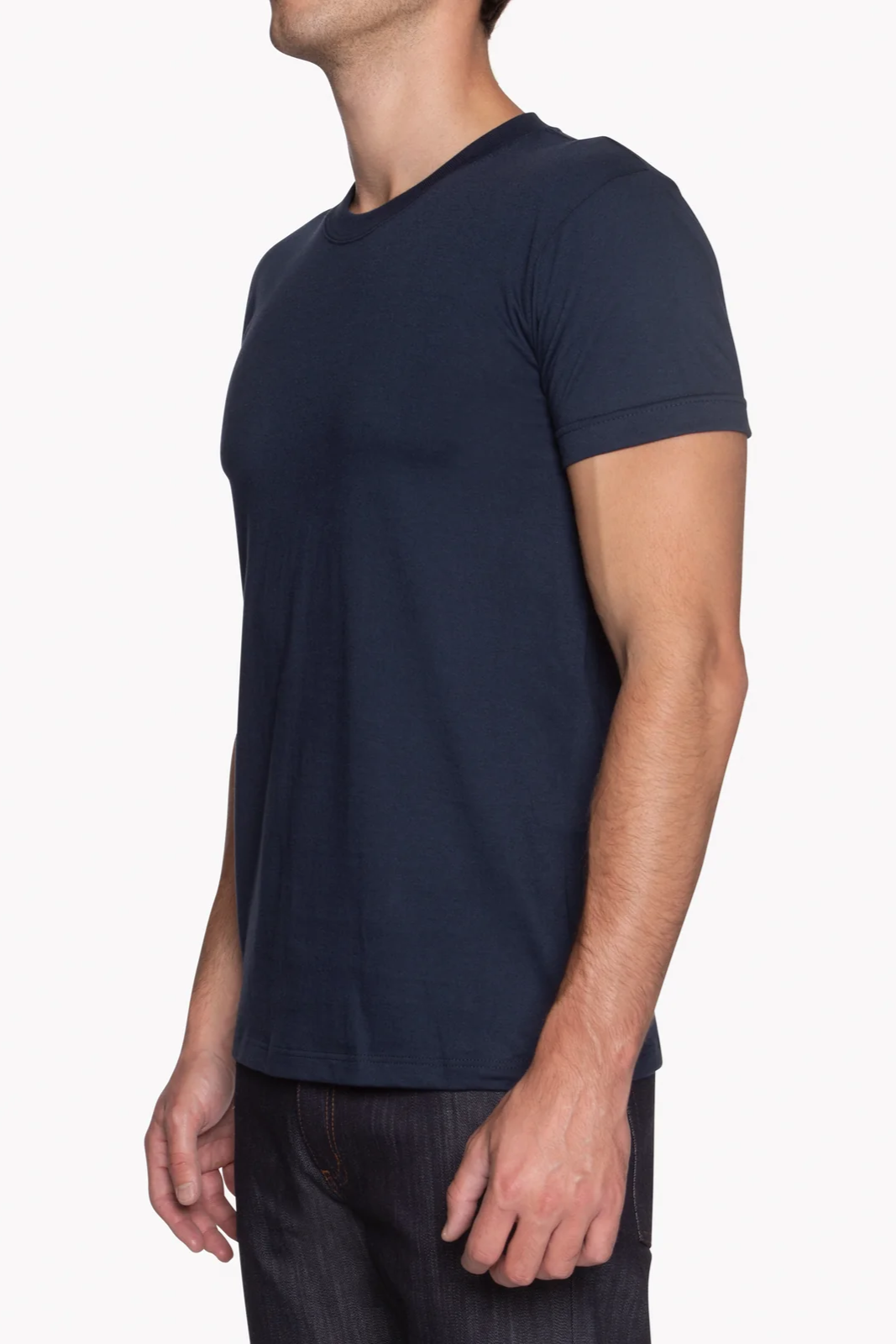 Person wearing a navy blue t-shirt on a white background