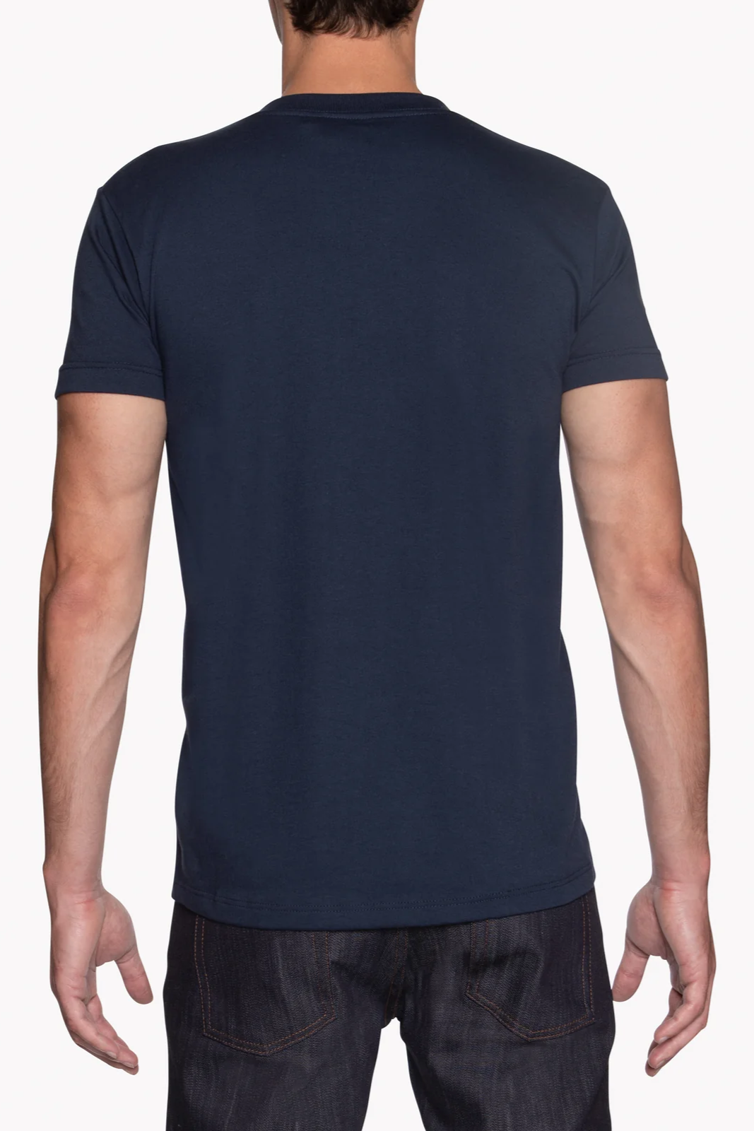Person wearing a navy blue t-shirt on a white background