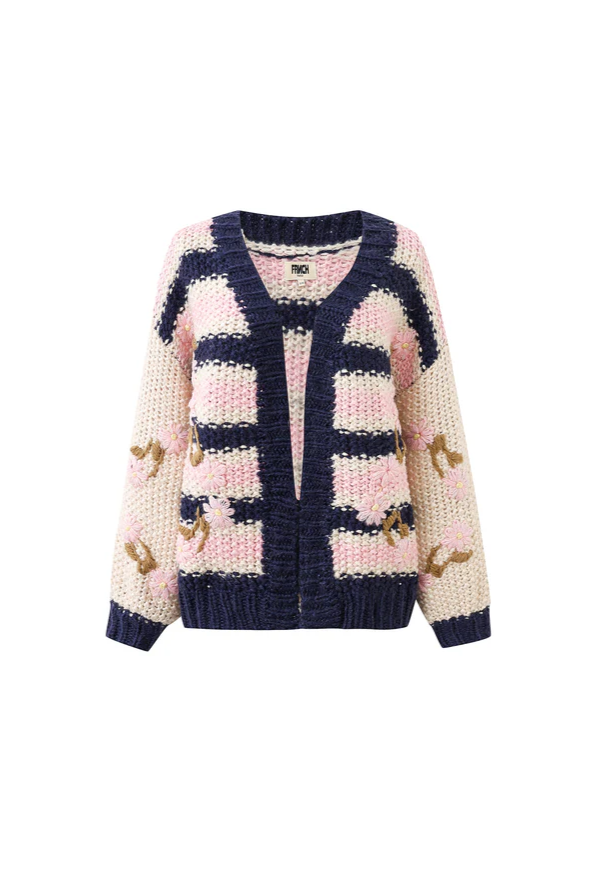 Knitted cardigan with pink and navy pattern on a white background