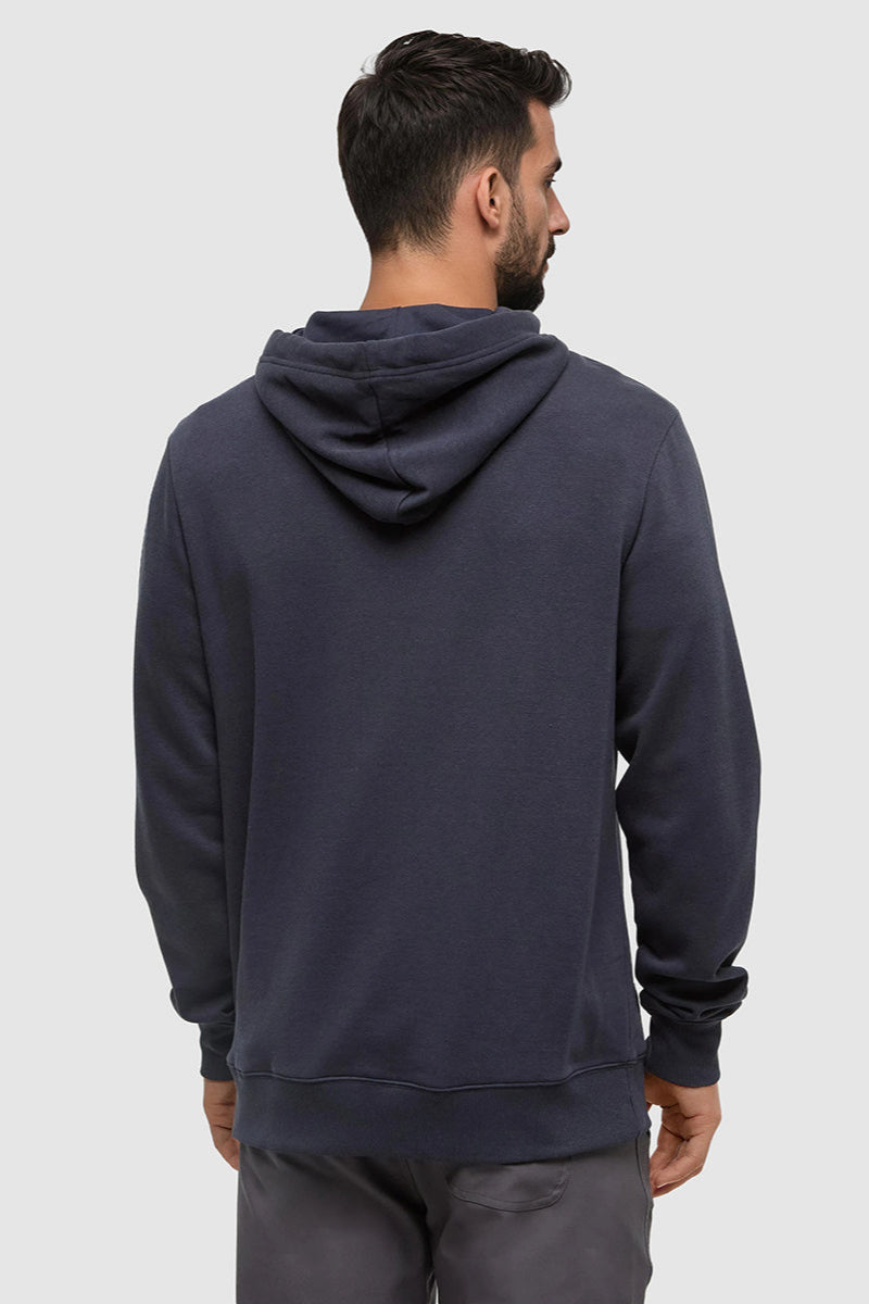 Man wearing a dark gray hoodie on a light gray background