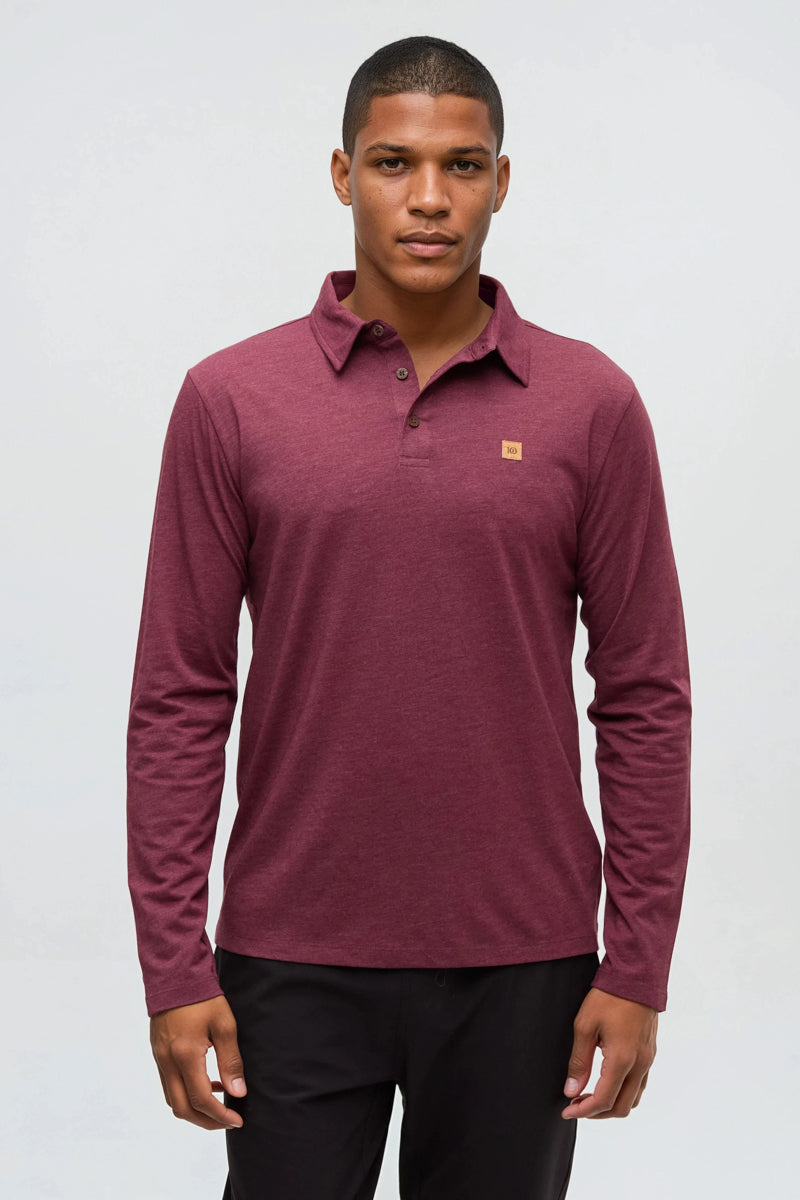 Man wearing a maroon long-sleeve polo shirt with a logo on a white background
