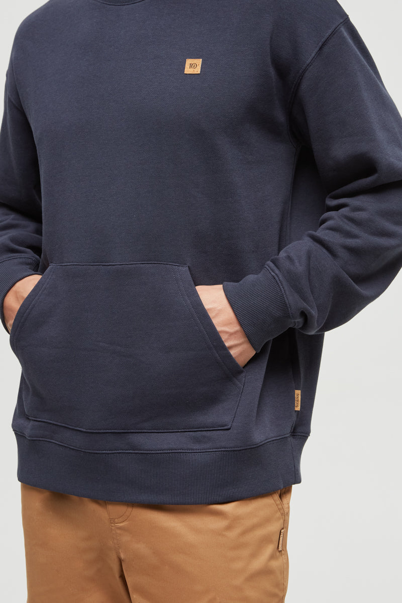 Navy blue sweatshirt with a small logo on a white background