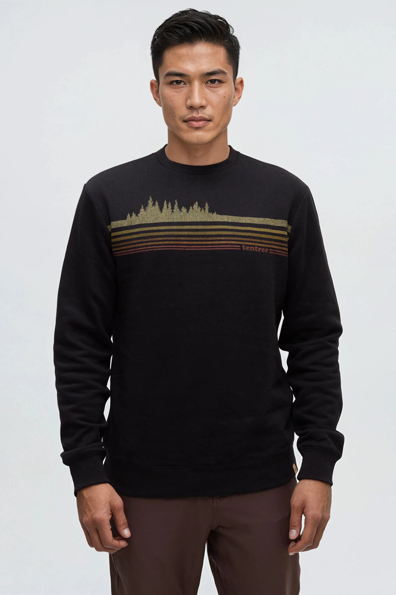 Man wearing a black sweater with a graphic design on a white background
