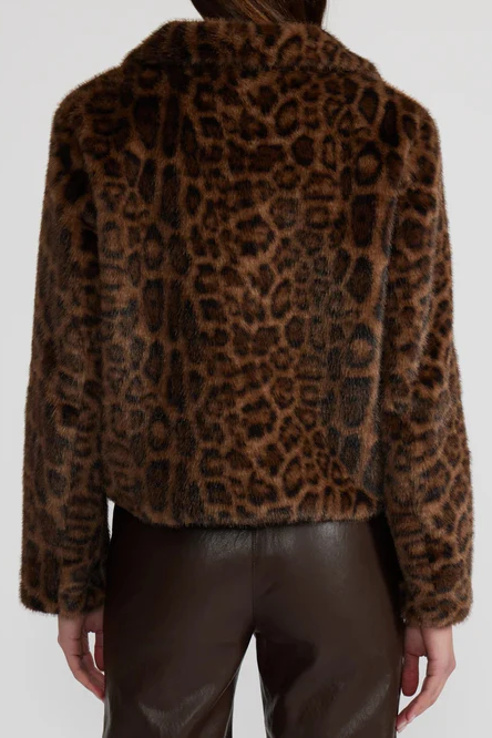 Leopard print jacket worn by a person on a white background
